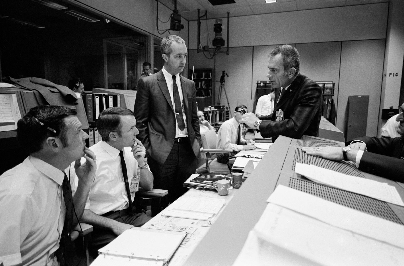 Controllers in Mission Control reacting to Apollo 13's safe return