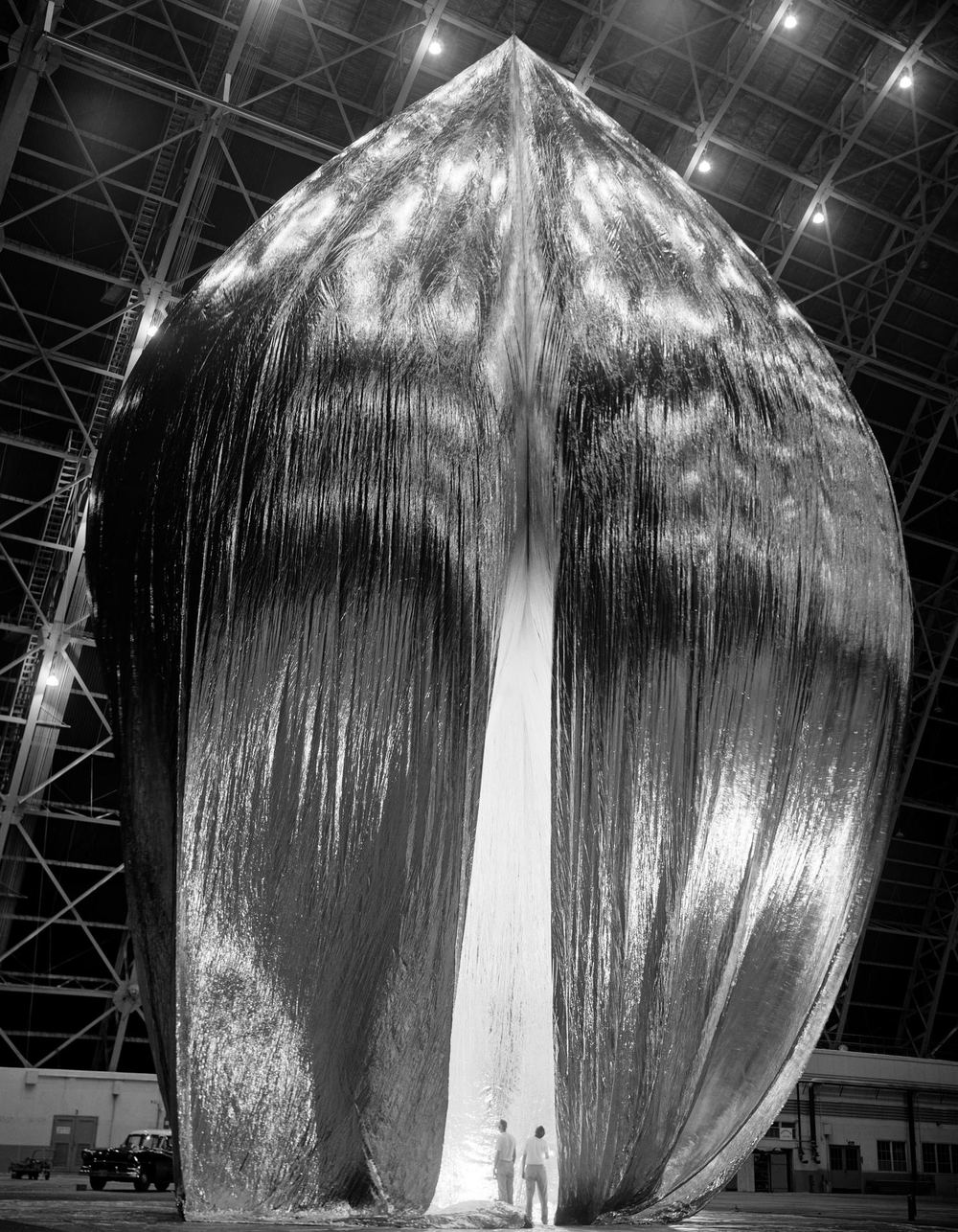 The Echo 1 balloon satellite being inflation-tested in a hangar