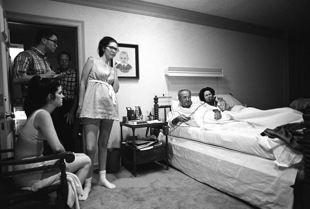 A 1960s family gathered around a television set