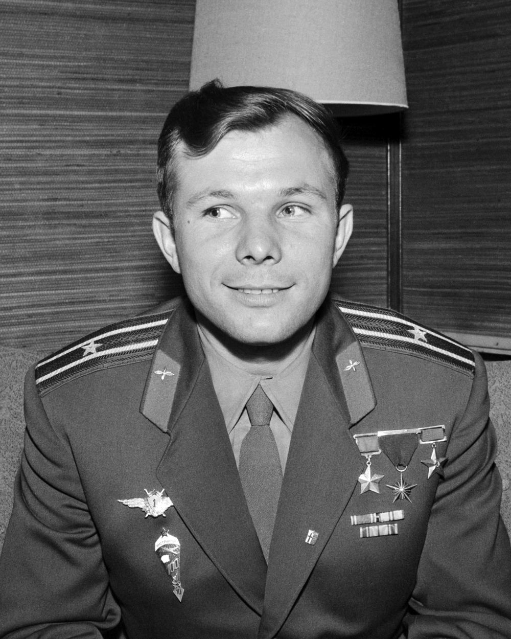 Yuri Gagarin smiling in his cosmonaut helmet
