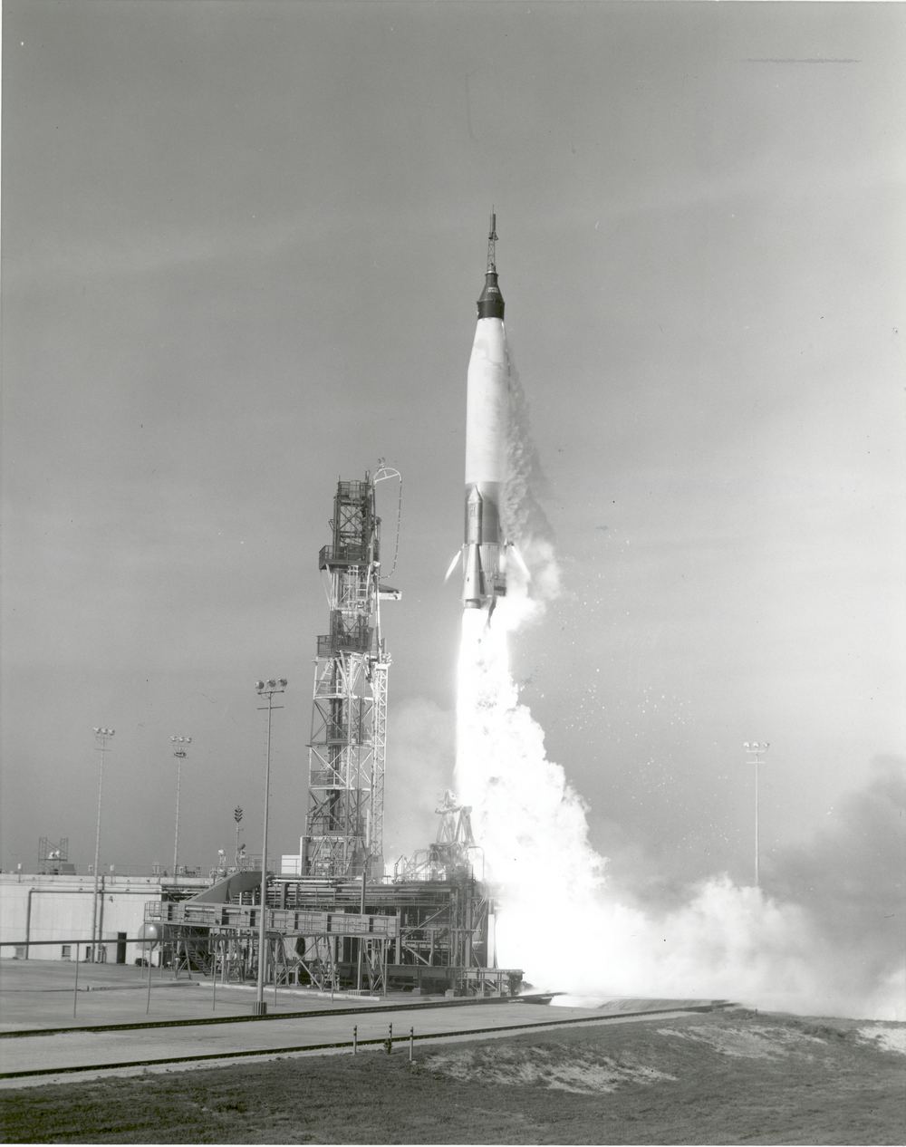 A Mercury-Atlas rocket climbing off the pad