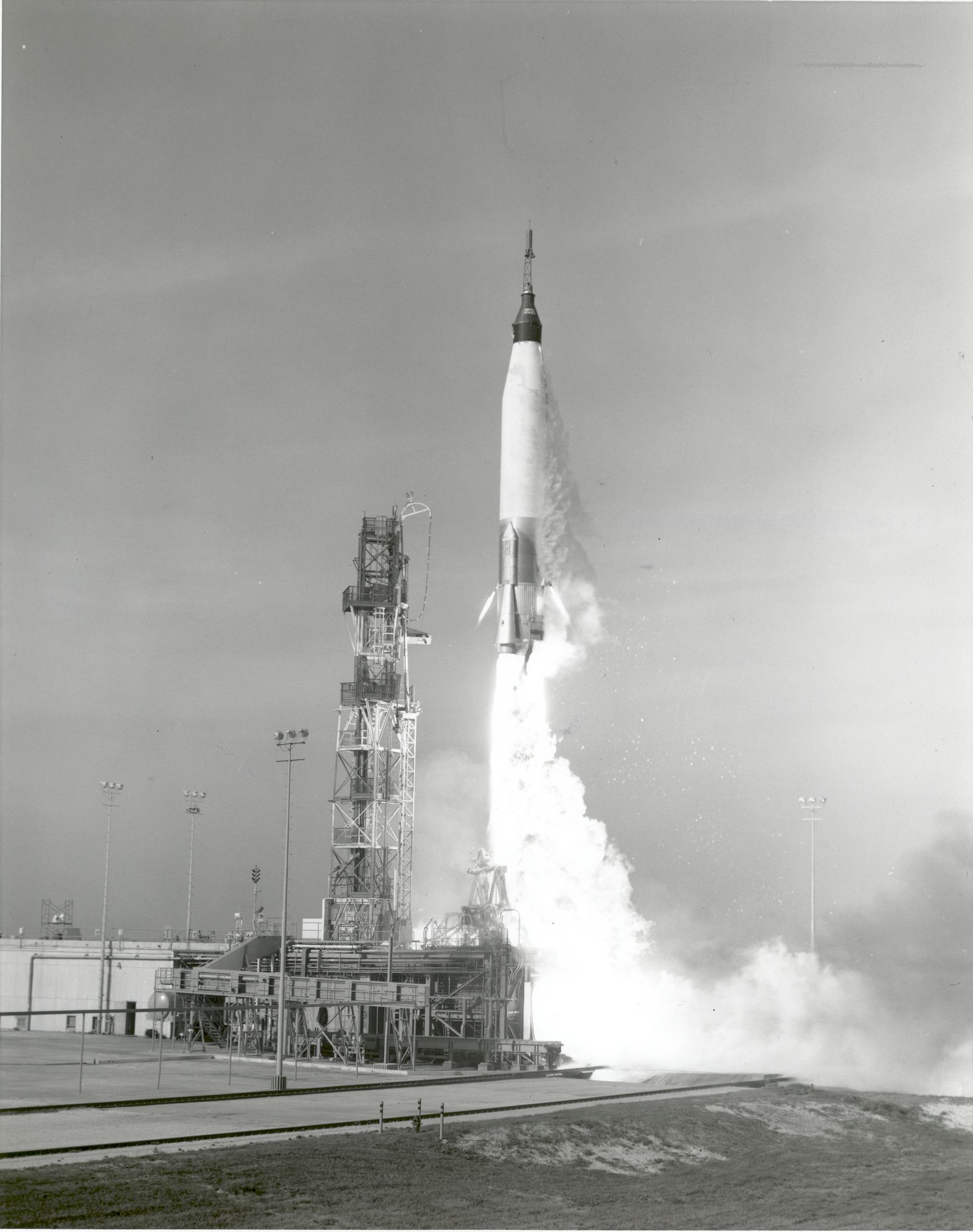 A Mercury-Atlas rocket climbing off the pad