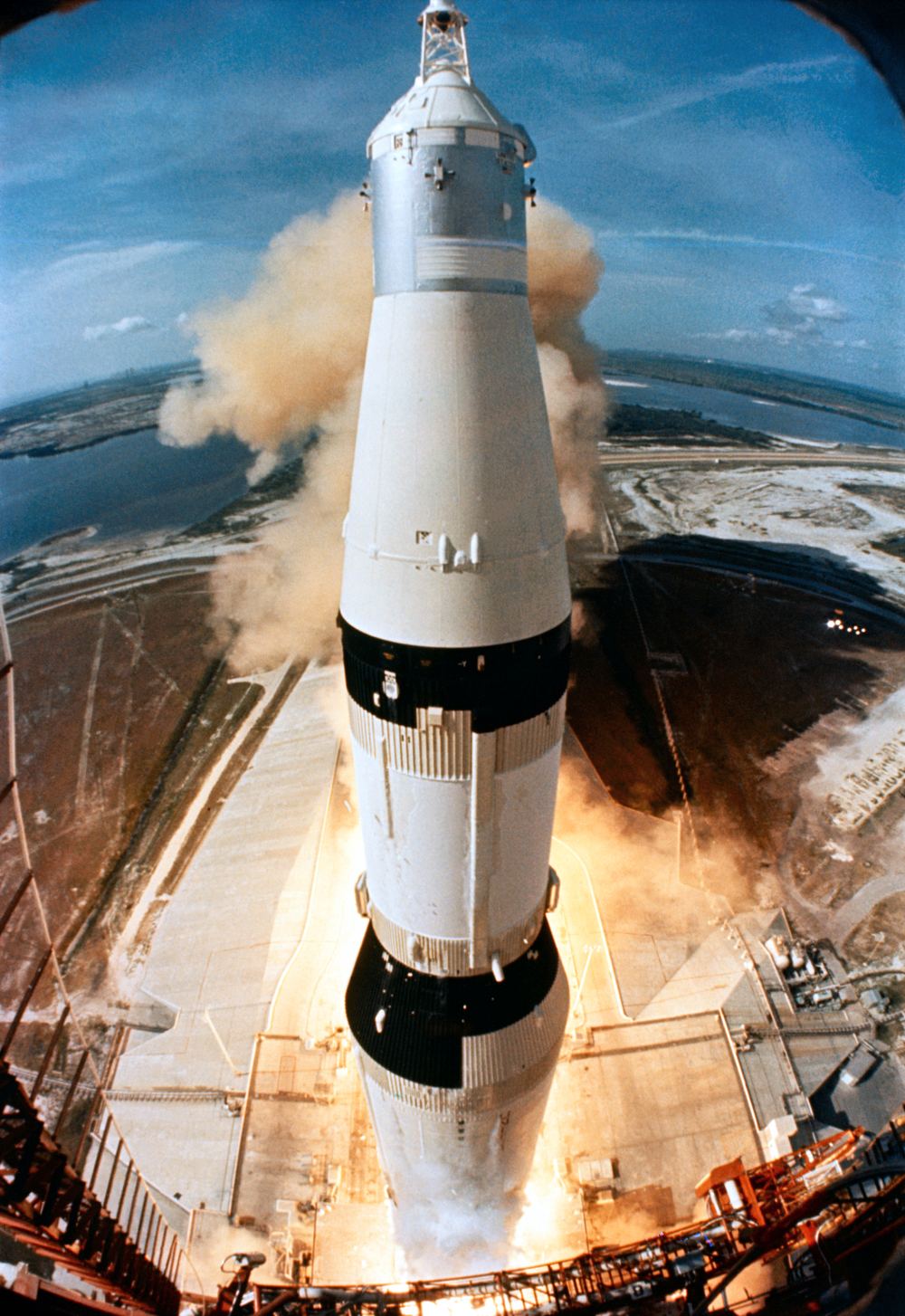 The Saturn V rocket climbing off the pad on a pillar of fire