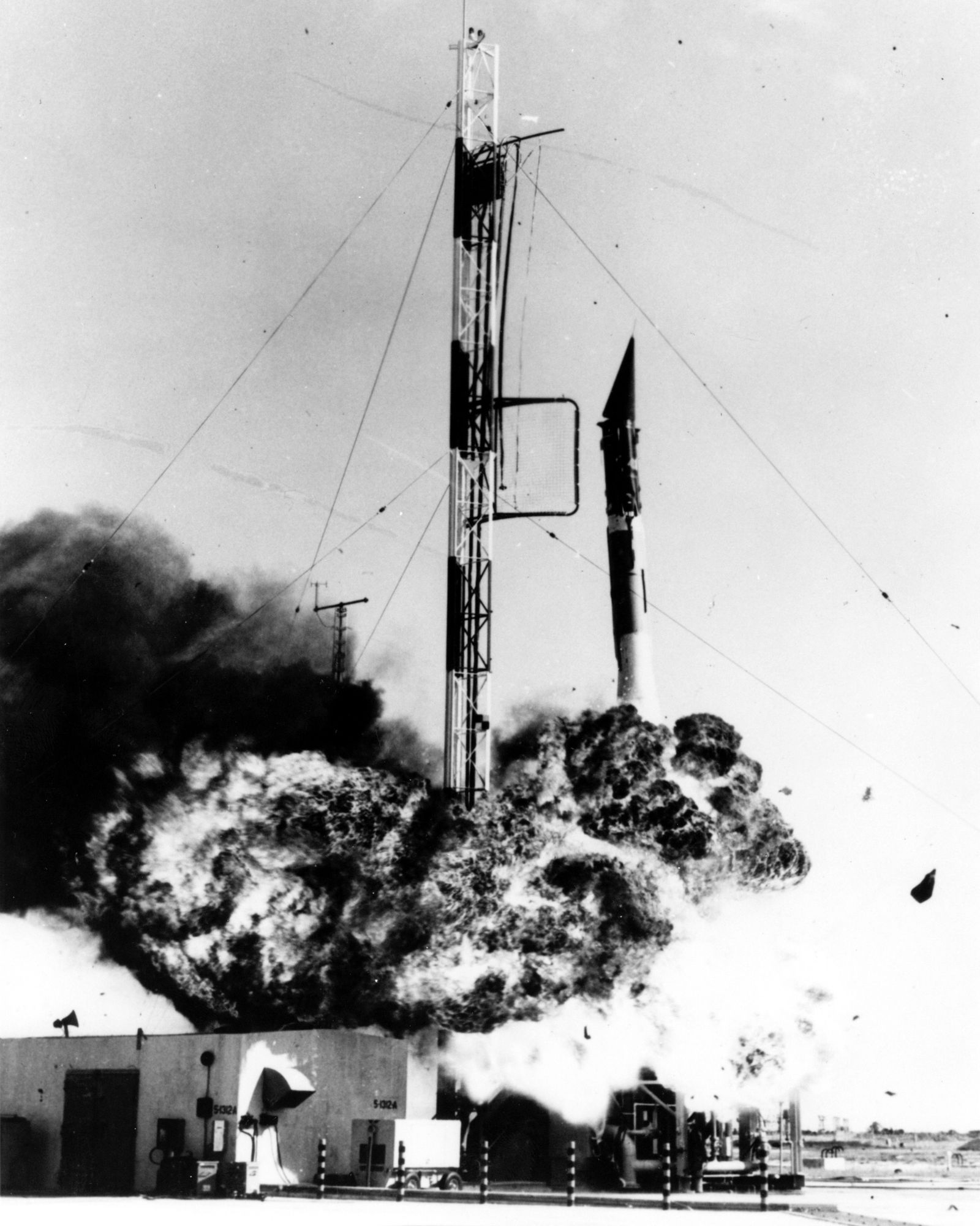 The Vanguard rocket collapsing in flames on the launch pad