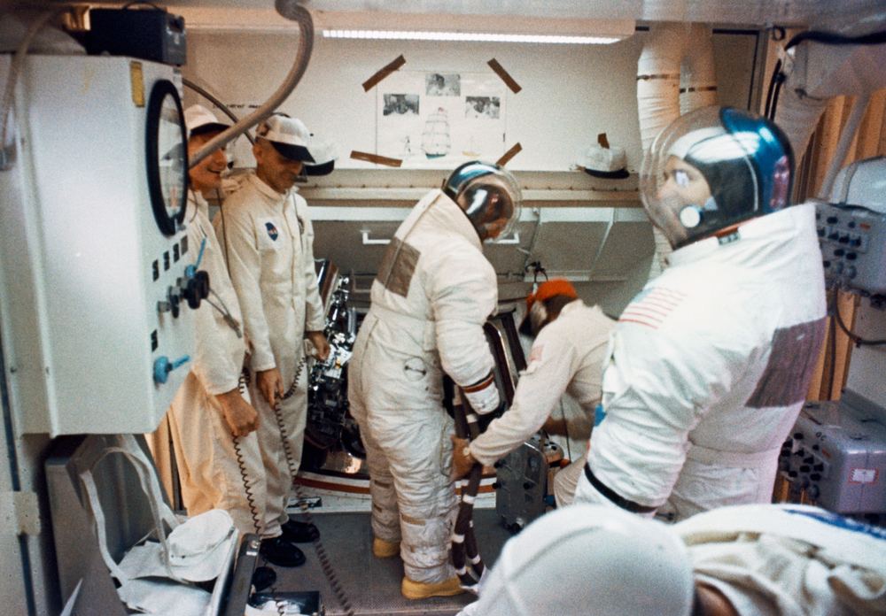 Technicians in the pad 'white room' at the top of the rocket
